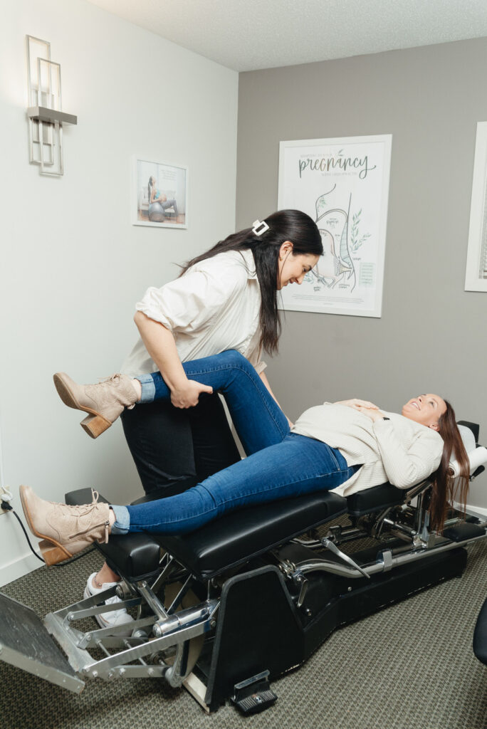 chiropractor adjusting a pregnant woman in Kalamazoo, Michigan